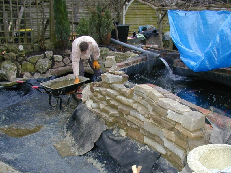 Pond with a waterfall under construction